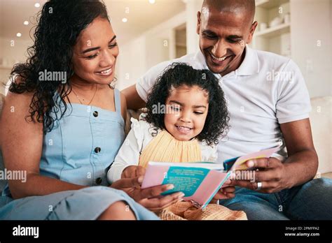 Family, happy and child reading story book, cartoon comic books and ...