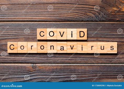 Inscription COVID Coronavirus on Wooden Background. Covid Word Written ...