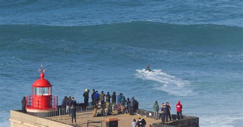 Nazare, Portugal - November 7, 2022 People watching the big giant waves ...