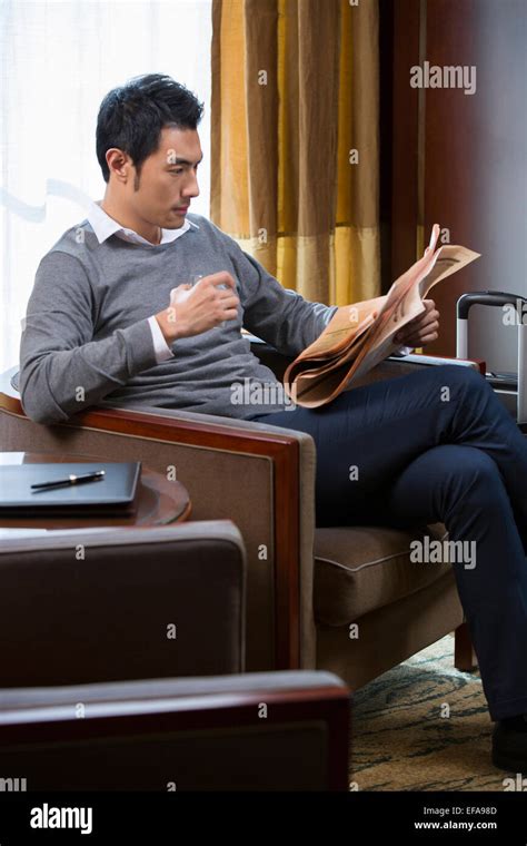 Newspaper hotel lounge hi-res stock photography and images - Alamy