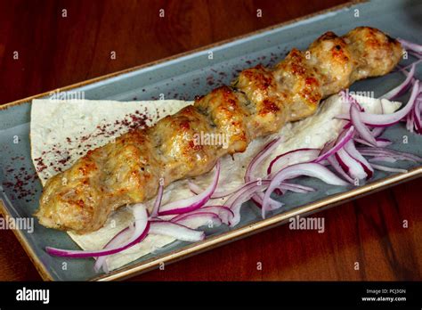 Chicken kebab with onion and caucasian bread Stock Photo - Alamy