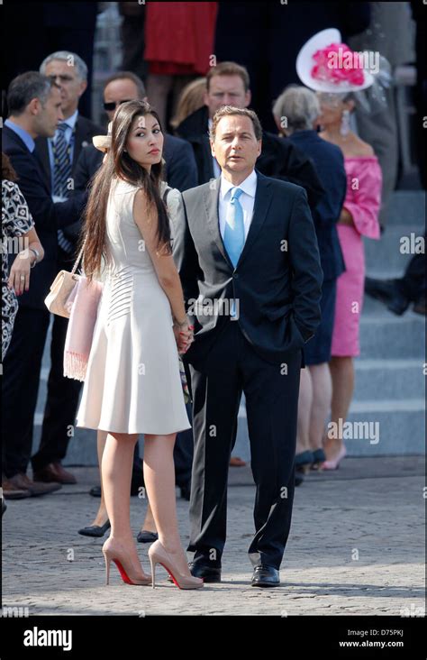 Industry Minister Eric Besson arrives with his wife Yasmine Tordjman ...