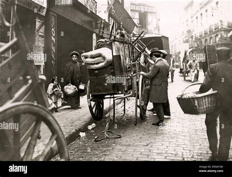 Moving home - street cart with furniture Paris France c.1920s Stock ...
