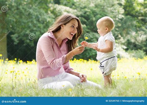 Beautiful Mother with Baby Playing in the Park Stock Image - Image of ...