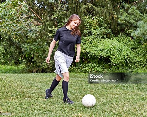 Girl Kicking Soccer Ball Stock Photo - Download Image Now - Active ...