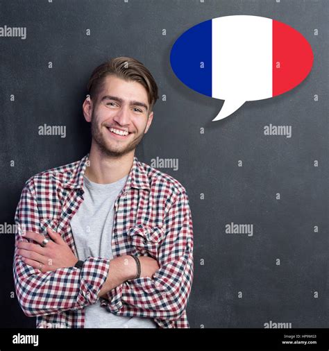 Man learn speaking french in bubble on chalkboard Stock Photo - Alamy