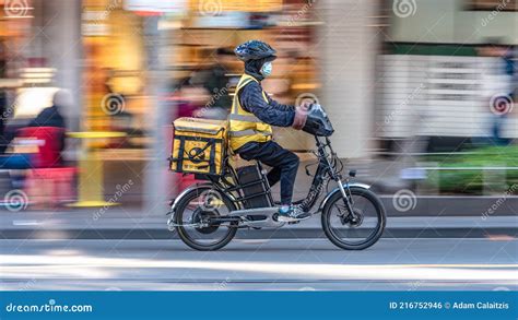 An EASI Food Delivery Motorcycle Driver is on His Way To Deliver Food ...
