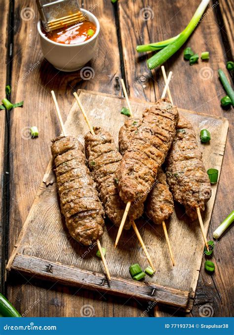 Kebab with Green Onions and Hot Sauce. Stock Photo - Image of delicious ...