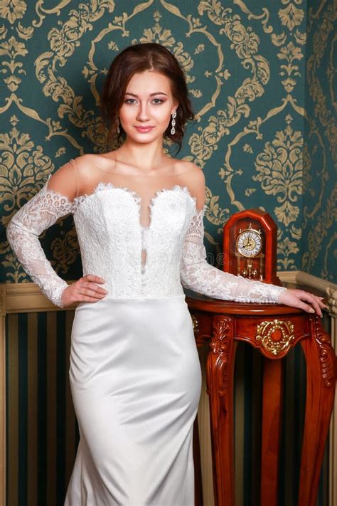 Young Beautiful Fashion Bride Posing in Studio. Wedding Dress Stock ...