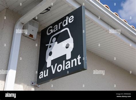 garde au volant sign car and french text means all-night drugstore in ...