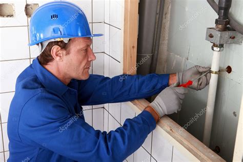 Plumber working on water pipes — Stock Photo © photography33 #9211898
