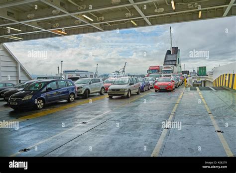 Cars parked on the outer deck of a passenger car ferry awaiting ...