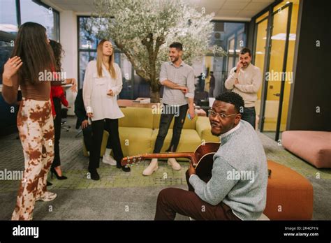 People play music on their speaker and dancing before their black male ...