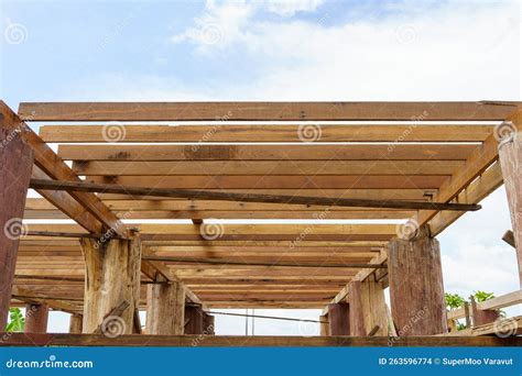 A Wooden Frame Structure with Massive Supporting Pillars Prepares the ...