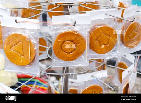 Artistic Dalgona Candy Shapes with symbols inside Stock Photo - Alamy