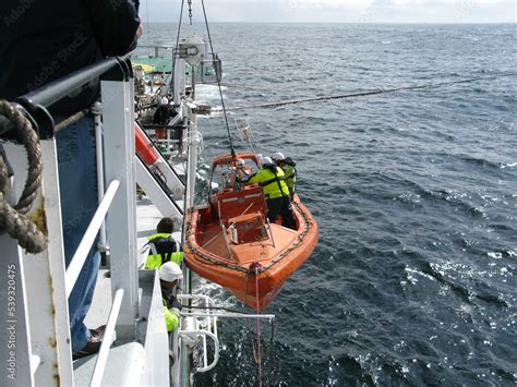 Preparing Fast Rescue Boat (FRC) for launching from a ship. FRC is used ...