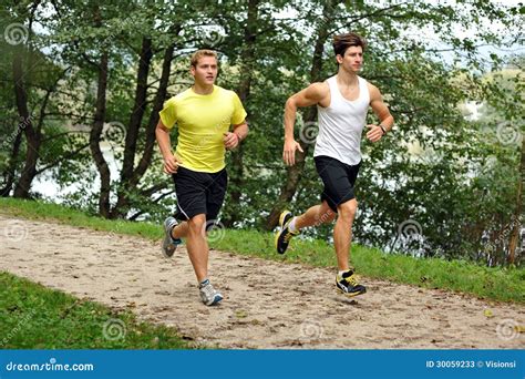 Two Men Athletes Running / Jogging Stock Image - Image of adult ...