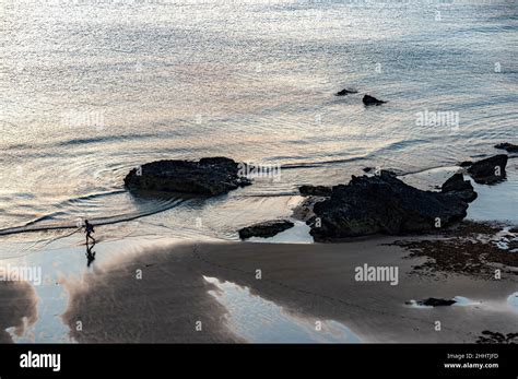 Cornwall,England-July 21 2021:At Carnewas at Bedruthan,a human figure ...