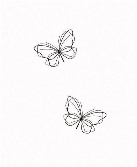 Two Butterflies Flying In The Sky With One Being Drawn On It S Back Side