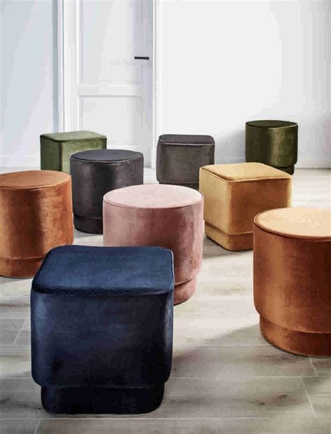 Several Different Colored Stools Sitting On The Floor