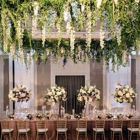 Floral Draping Ceiling And Tall Floral Centerpieces And Bowls Wedding