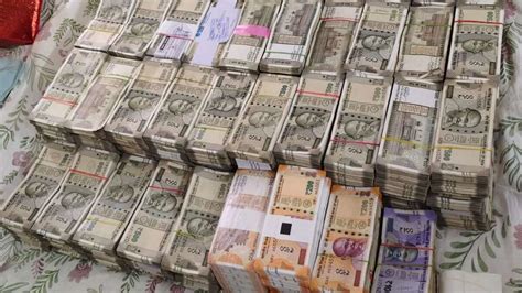 acb arrests electricity dept worker seizes  rs  cr cash  kin