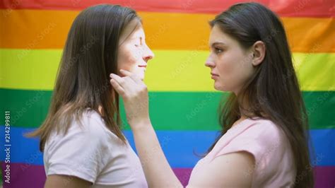 Lesbian Couple Kissing On Rainbow Flag Background Same Sex