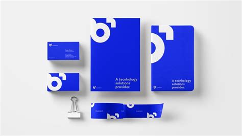 The Logo And Stationery Design Is Blue With White Letters Which Are