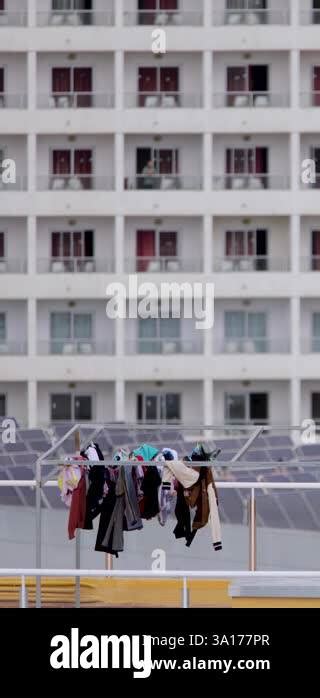 Portrait Footage Of Clean Clothes Drying And Pegged On A Washing Line