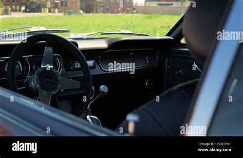 Interior View Of A 1965 Ford Mustang With Industrial Backdrop Stock