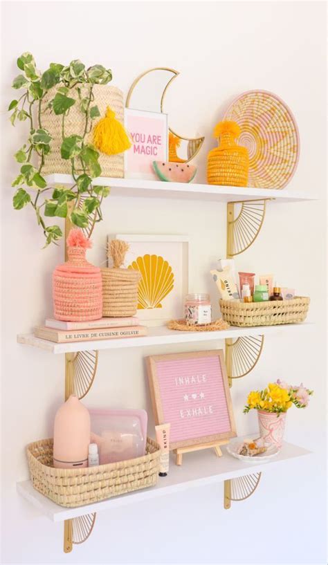 Some Shelves With Various Items On Them And Plants In Vases Next To