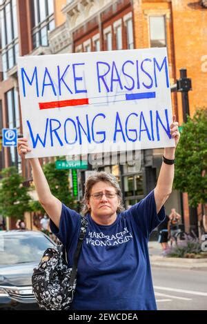 A Protester Holds Up A Placard That Says You Re Getting Stronger