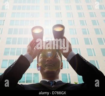 Composite Image Of Businessman Looking Through Telescope Stock Photo