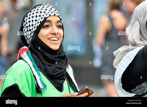 Young Woman Dressed In The Colours Of The Palestinian Flag At The March