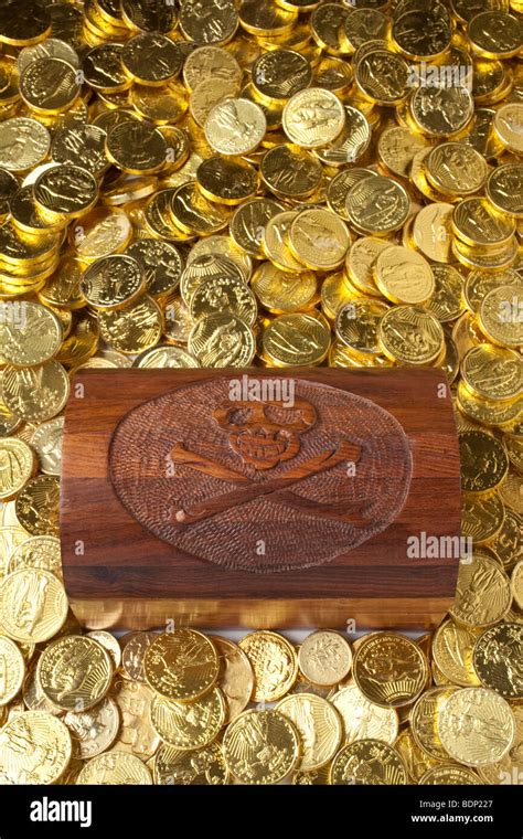 Treasure chest surrounded by gold coins Stock Photo - Alamy