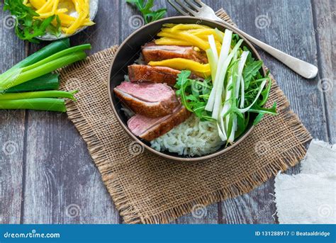 Hoisin Duck with Mango, Spring Onion, Rocket Lettuce Salad and Rice ...