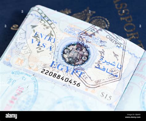 Macro Image Of Visa And Immigration Stamps In Us Passport For Cairo