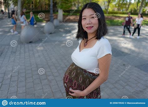 Young Happy And Beautiful Asian Chinese Woman Posing Outdoors Happy And Cheerful Pregnant