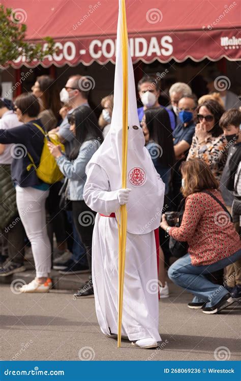 Vertical Shot Of A Hooded Penitent During The Holy Week In Madrid