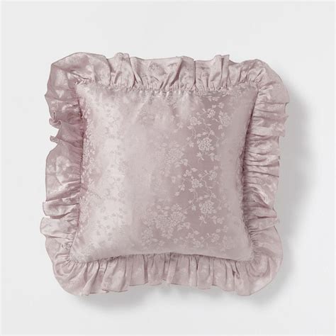 A Pink Pillow With Ruffled Edges On A White Background It Looks Like