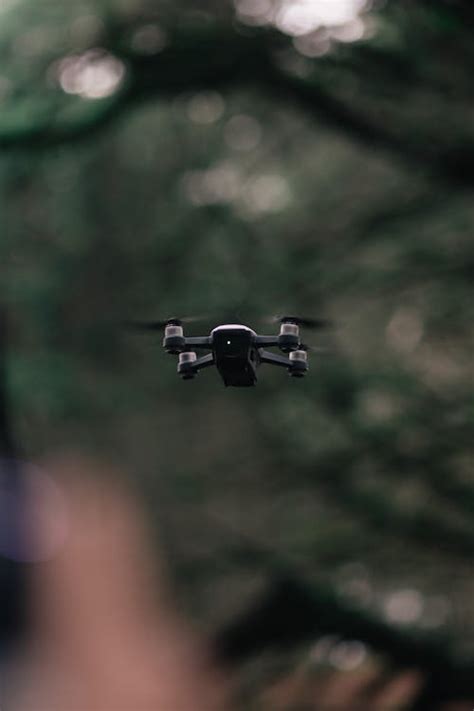flying white quadcopter drone  stock photo