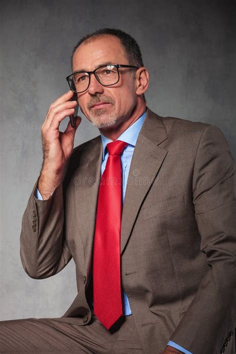 Successful Businessman Wearing Glasses Calling With His Smartphone