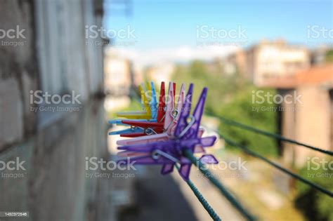 Clothespins For Drying Washed Clothes Of Various Colors Are Fixed In