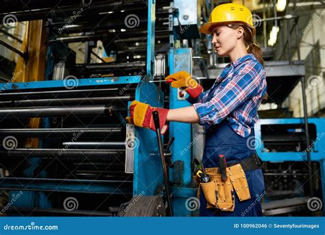 Young Woman Operating Machine Units In Workshop Stock Photo Image Of