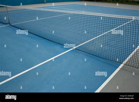 Hard Blue Tennis Court Where You Can See Its Straight Lines As Well As