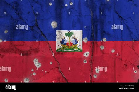 Full Frame Photo Of A Weathered Flag Of Haiti Painted On A Cracked Wall With Bullet Holes Stock