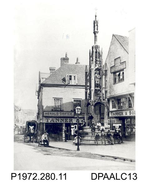 Photograph, black and white, showing the Buttercross, High Street
