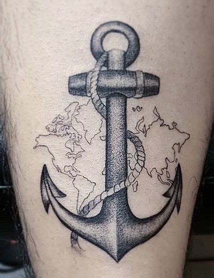 An Anchor Tattoo On The Side Of A Person S Leg With World Map In The