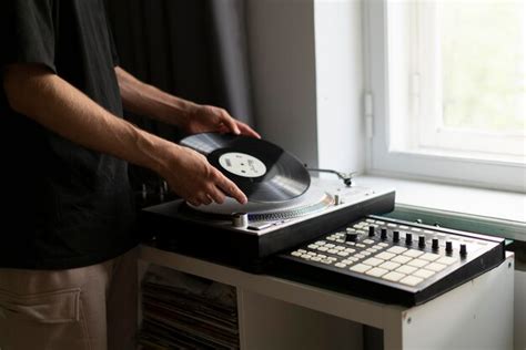 Premium Photo Man Changing Record On Vinyl Player