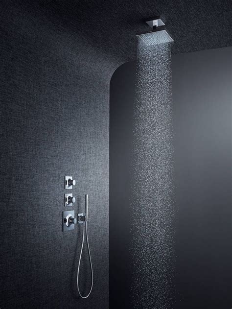 a shower head with thermostaer and faucet in black wallpaper